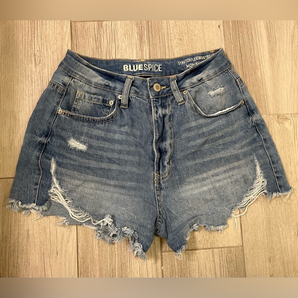 Blue distressed jean shorts in a 7.
